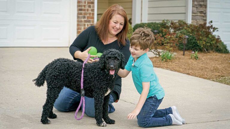 Rachel Webb Turner with her son and dog in inspiring stories of animals helping humans