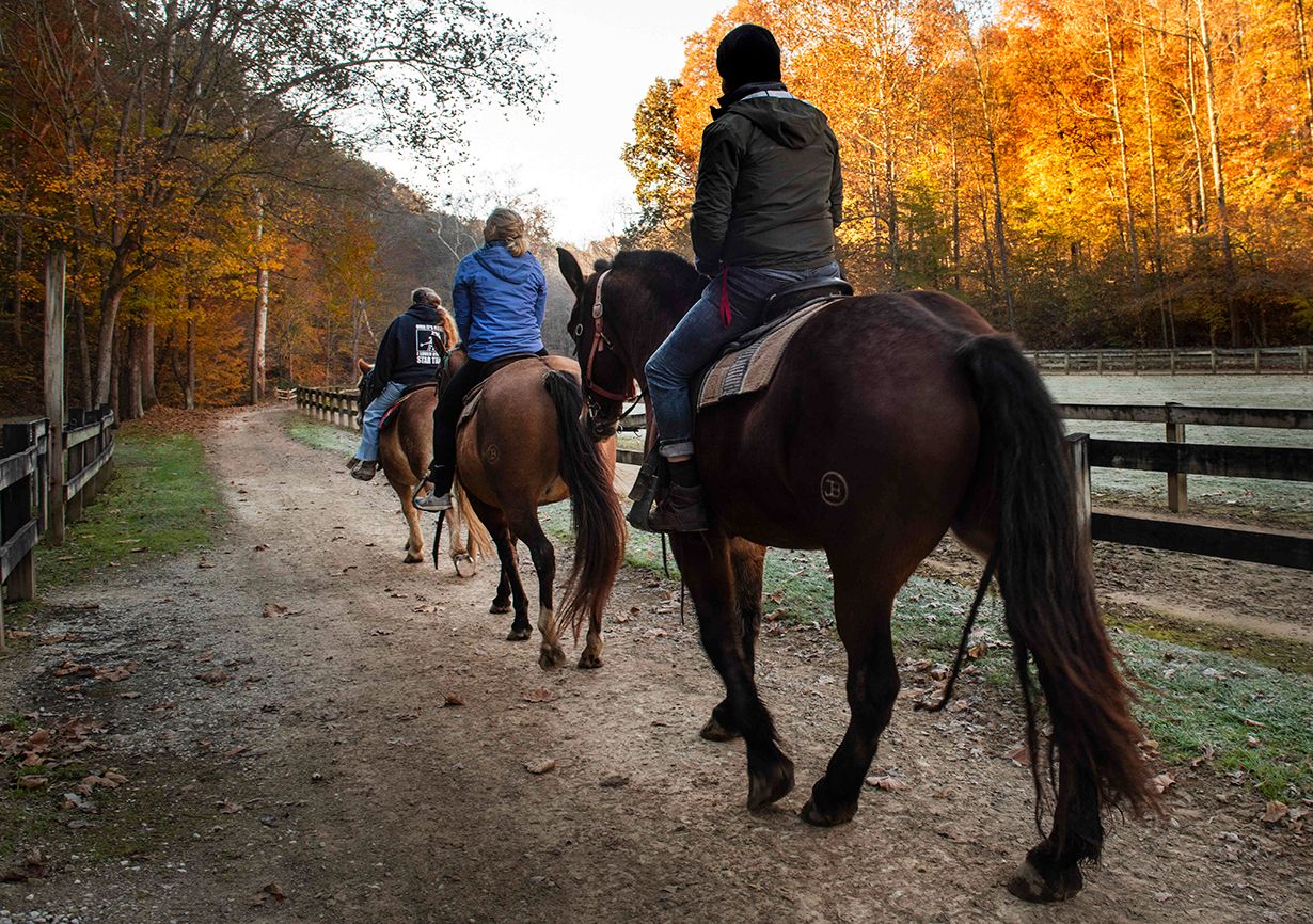 Horseback riding on a trail in the state park made even more scenic by the fall foliage; photo by Scott Goldsmith