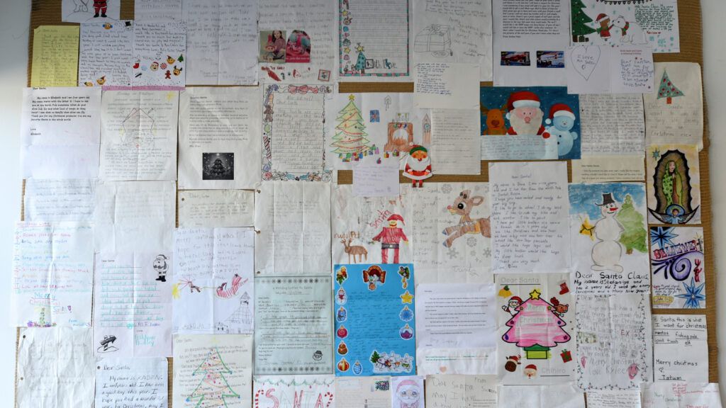 A bulletin covered in letters to Santa